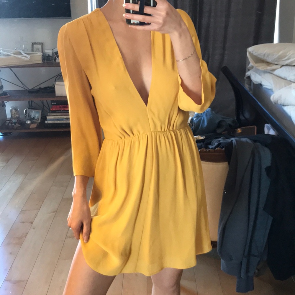 Reformation yellow mini dress with low v sz 0